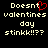 Pixelated text on black background with red heart symbol replacing 'o' in Doesnt, two identical side-by-side versions of the same phrase.