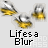 Animated icon shows three yellow and silver objects with motion blur on gray background, text 'Lifes a Blur' below, red 'badassbuddy.com' text above.