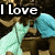 A pixelated image of a person in light blue clothing holding an object, with text overlays reading "I Love" and "You" on separate