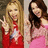 Two women in red and pink dresses pose side-by-side with hands raised, one holding a white object.