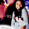 repeated images showing a person in a light blue sweater holding a small object, with text and heart symbols overlaid