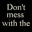 A static image displays repeated text fragments in red, white, and blue over a dark background with pixelated textures.