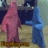 Two stylized figures stand side-by-side on a brown base against a muted background, one in pink and the other in blue.