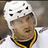 A pixelated image of a hockey player in a white jersey with yellow and black trim, wearing a white helmet, against a blue background with yellow text.