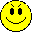 Four yellow pixelated smiley faces arranged in a on gray background, each with distinct facial features and expressions