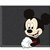 Pixelated cartoon character with black ears and red shorts stands against dark background holding white object.
