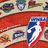A pixelated image shows a shield-shaped icon with blue, white, and red colors on an orange background, with partial text reading "Sun" and "Rocks" below.