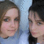 Two people in a close-up portrait with light blue background, one wearing dark clothing and the other in lighter tones.