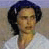 Static pixelated image of a person with dark hair and light skin wearing a white top against a muted background.