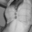 Grayscale pixelated image with abstract dark shapes and light background, no discernible subjects or text.