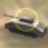 Pixelated image of a dark-colored tank with a yellow circular outline on a muted background.