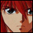 Pixelated anime-style character with red hair and green eyes, side profile on left, black background with white text on right.