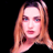 Static pixelated image of a person with long light brown hair against black background, rendered in low-resolution style typical of early 2000s instant messaging icons.