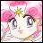 Pixelated chibi-style face with large eyes, pink hair bows, and a yellow flower accessory on a light background.