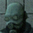A pixelated character with a bald head and large eyes appears in four , showing slight variations in facial expression and hand position against a -patterned background