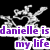 A pixelated silver key-shaped icon with a heart cutout, featuring purple text reading "danielle is my life" on a black background.