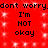 Red background with white sparkles and repeated black text reading "don't worry.don't worry. I'm NOT okay" in two identical vertical