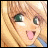 Pixelated anime-style character face with blonde hair and green eyes on left, alongside pixelated text "Anime IM" above smaller "com" on black background.