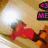 Pixelated image of a red cartoon character lying on its back with arms raised, next to an orange figure and bright light source.