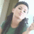 A pixelated image of a person with long dark hair wearing a green top, holding a phone, next to text reading "Taa Taa <3'z Yo U! :]".