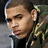 Pixelated image of a person with short hair wearing a dark jacket and green patterned scarf, with text overlays on black background.