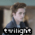 Pixelated image of a person with brown hair wearing a dark blue jacket over a light blue shirt, with a black banner displaying 'twilight' in white text at the bottom.