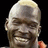 Pixelated close-up of a bald man's face with a neutral expression, light skin tone, and visible ear, set against a black background.