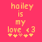 Pixelated text on a bright pink background reads 'hailey is my love <3' with five yellow stars below, one of which changes color.