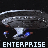 Pixelated spaceship with blue thrusters and white dots on hull, labeled 'ENTERPRISE' in blocky text below, set against black background.