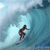 Pixelated static image of a surfer riding a wave in blue and white tones with visible dithering and low-resolution rendering artifacts.