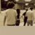 Animated contact sheet of 18 frames showing a group of people walking away from the viewer in sepia tones with text fragments and stars appearing across frames.