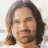 pixelated images showing a person with long hair and facial hair, overlaid with red text reading "JOHNNY IS MY HOMEBOY" in various color combinations