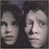 Two figures with dark hair and pale skin appear in a of four , each showing subtle facial expression changes