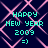 Pixelated cyan text 'HAPPY NEW YEAR 2009 =)' on dark blue background with pink geometric lines, repeated in four identical quadrants.