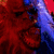 A red and blue pixelated image of a character with an open mouth, partially visible face, and dark eyes.