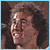 Pixelated image of a person with curly brown hair smiling in the top-left, another expression in the top-right, and 'LOGNS RUN' text over waves below.