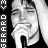 Black-and-white pixelated image of a person singing into a microphone with vertical text reading "GERARDO" on the left side, displayed as a static buddy icon.