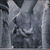 A grayscale image of a draped fabric texture with visible folds and creases, appearing as a static background element.