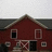 A pixelated image of a red barn with white trim and dark roof, divided into four quadrants with text overlays on two sections.