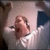 A pixelated animated sequence shows a person in white clothing with light skin, first covering their face then lowering hands to reveal closed eyes and a neutral expression.