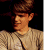 A 50x50 pixel buddy icon split into two sections: a left-side portrait of a person with brown hair and light clothing, and a right-side green background with bright green text reading "Original Icons .com".