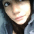 A person with dark hair and light skin wears a gray hoodie, shown in three slightly different poses against a plain background.