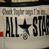 A static image shows text reading 'Chuck Taylor says I'm an...' above large bold letters 'ALL STAR' with a star symbol replacing the 'O' in 'STAR', and a registered trademark symbol below the star.