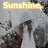 A static image with text overlays on a grayscale background showing blurred figures and foliage.