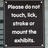 Black rectangular sign with white text reading "Please do not touch, lick, strafe or mount the exhibit." displayed in a