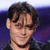 A person with dark hair and a black shirt appears in four showing subtle facial expression changes against a purple background