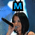 A person with short dark hair sings into a microphone while wearing a black crop top and camouflage shorts, overlaid with blue letters M A Y.