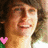 Pixelated image of a person with brown hair and light skin, next to green text reading 'LOVE teddy' on white background.