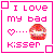 Pixelated static icon with pink text and symbols inside a pink border frame on white background.