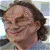 A 50x50 pixel animated contact sheet showing two frames of a buddy icon with a person's face on the left and green text logo on the right against a dark background.